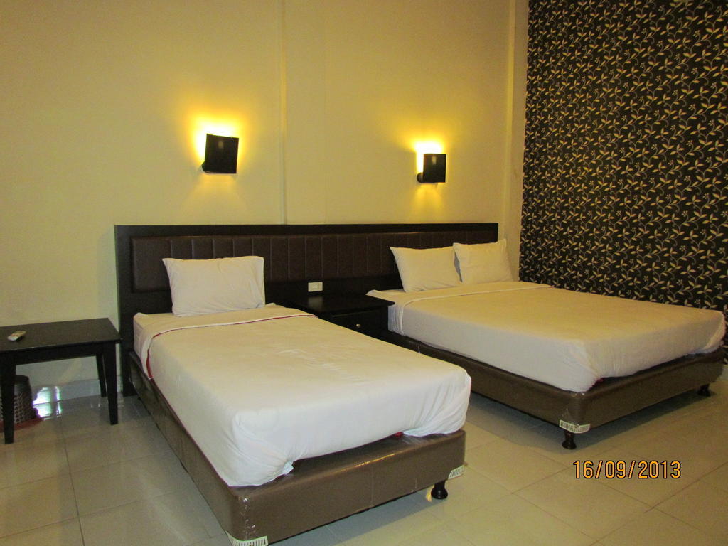 Carolina Transit Hotel Medan Szoba fotó