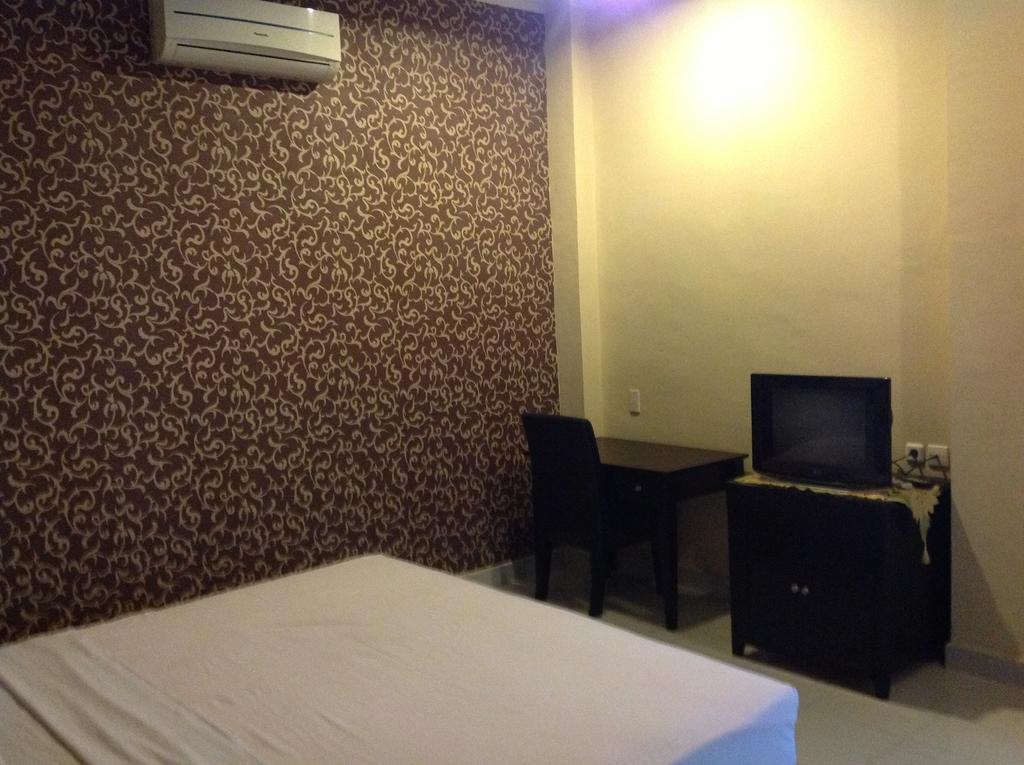 Carolina Transit Hotel Medan Szoba fotó